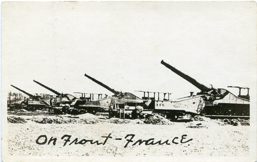 Real-photo postcard of a military railway artillery guns on train tracks, parked somewhere along the front in France during World War I (Undated) [Photograph by: Shaffer].