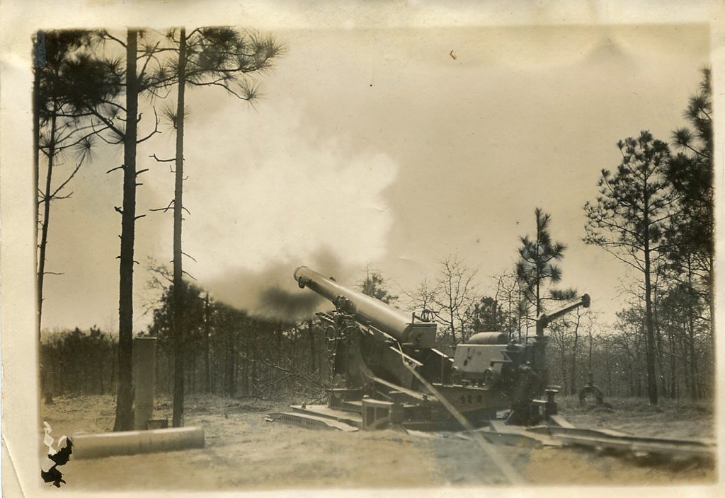 Photograph of a large U.S. Army field artillery gun firing at the training area at Fort Bragg, N.C., around the 1920s [circa 1920s].