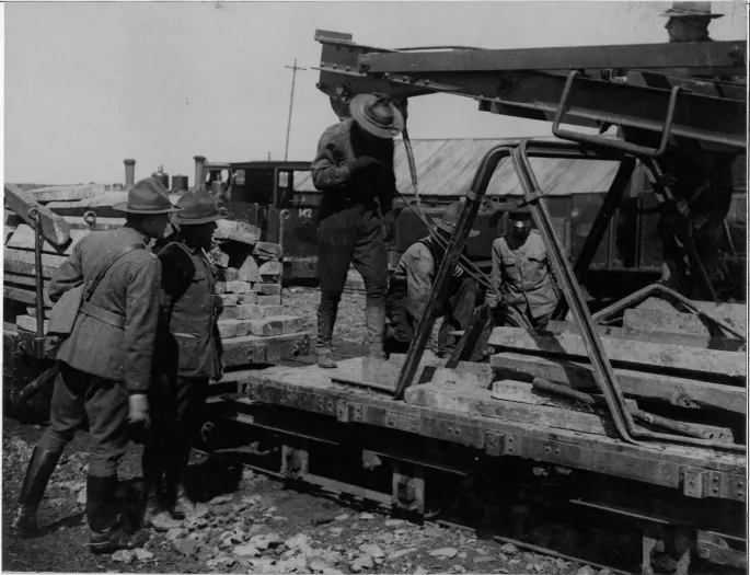 A group of American volunteers from the 11th Engineers Regiment at work preparing light railways at Boisleux-au-Mount, near Cambrai, 1917. (National Archives Identifier 16577325)